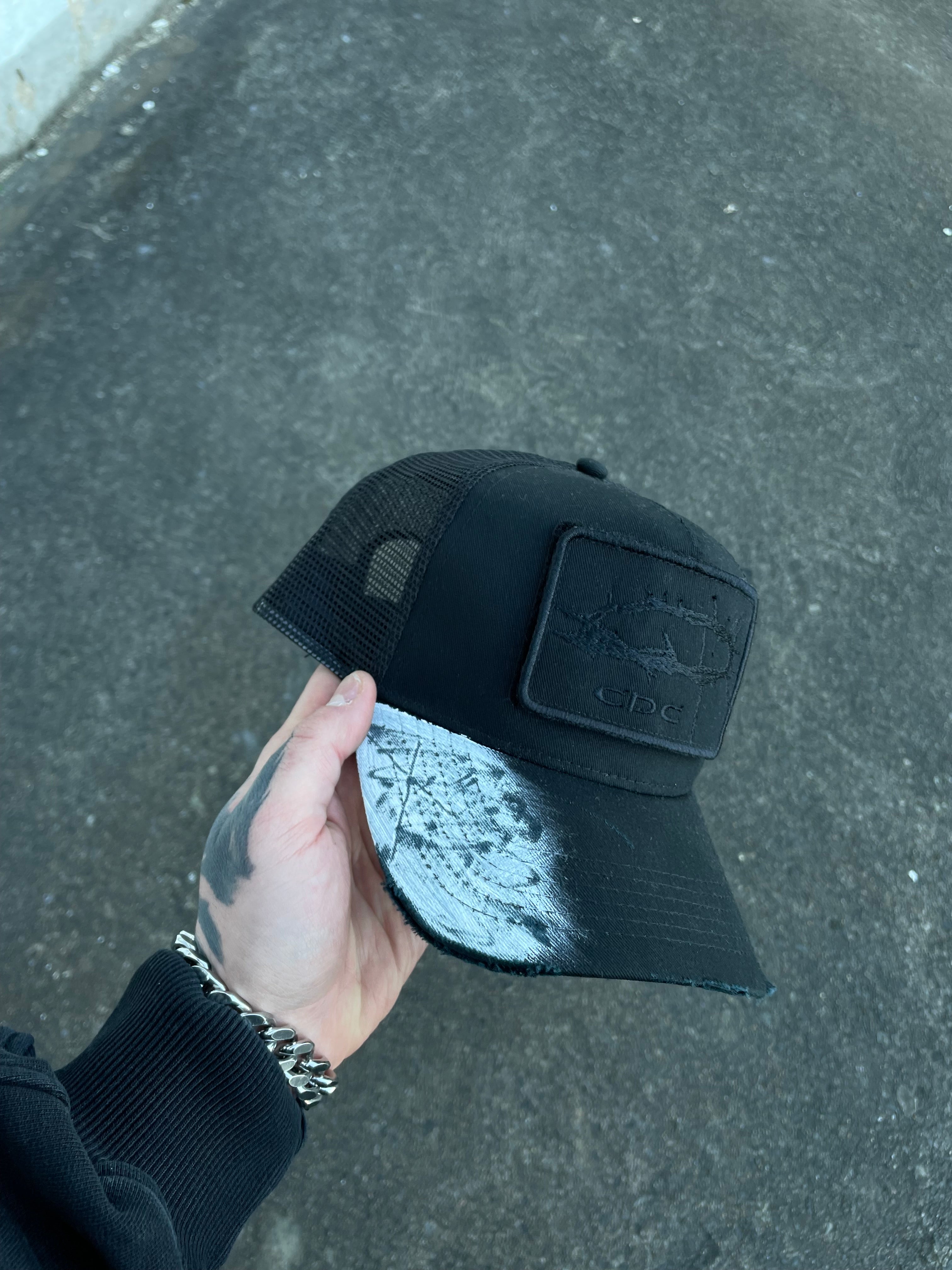 i_001 CAP CDC LOGO BLACK ON BLACK